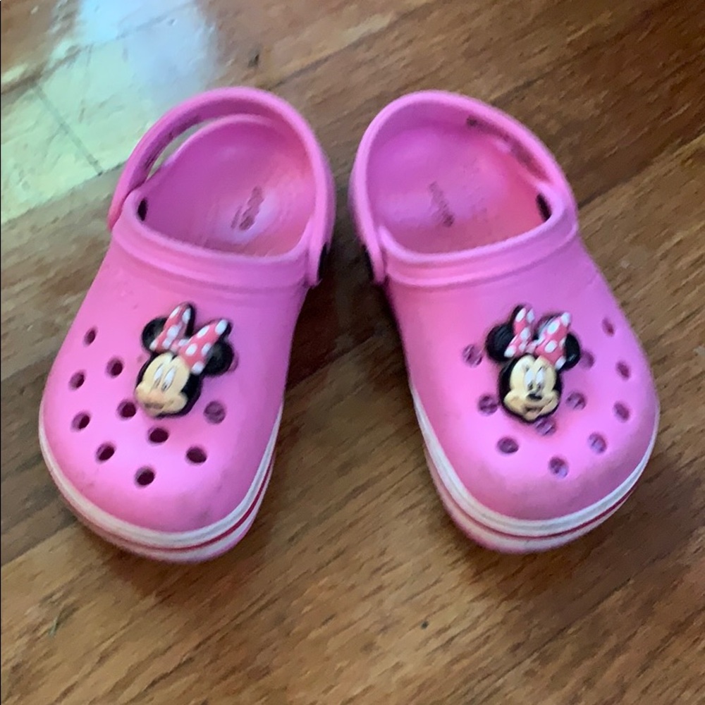 Children’s pink Crocs with Minnie Mouse pins